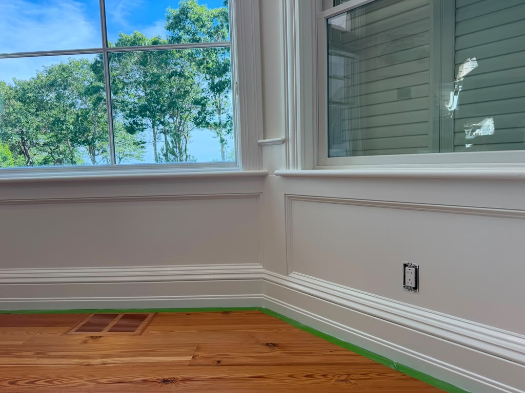 Custom white built-in cabinetry completed by finish carpenters